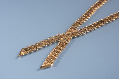 null NECKLACE in 18 ct gold made of two ribbons with flat fancy links crossing each...