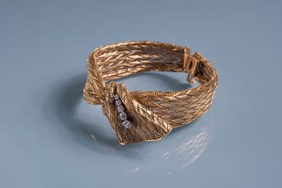 null BEAUTIFUL FLEXIBLE BRACELET in the form of a knotted ribbon in 18 ct gold with...