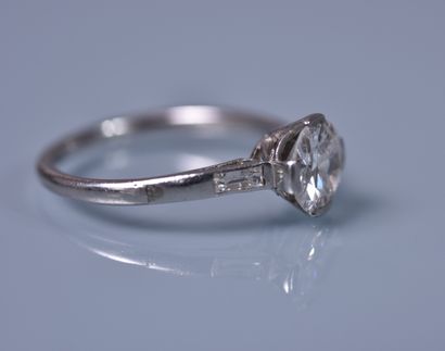 null A platinum SOLITARY set with a brilliant cut diamond weighing approximately...