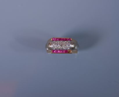 null 18K gold TANK ring set with small diamonds and a row of calibrated rubies. About...