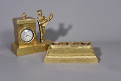 null A gilt brass BORNE HOLDER decorated with a lute player. It discovers an inkwell...