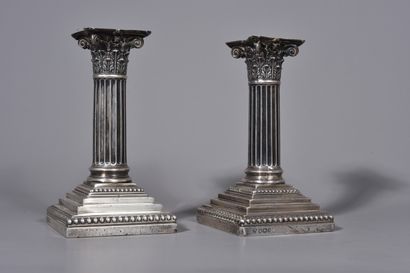 null HAWKSWORTH, EYRE and CO Ltd. A PAIR OF SILVER CANDLES of square cross-section...