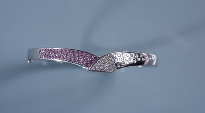 null LF. A white gold JONC BRACELET styling a snake, one quarter of which is set...