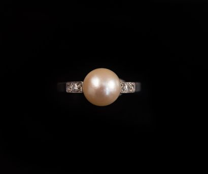 Platinum ring set with a cultured pearl and...