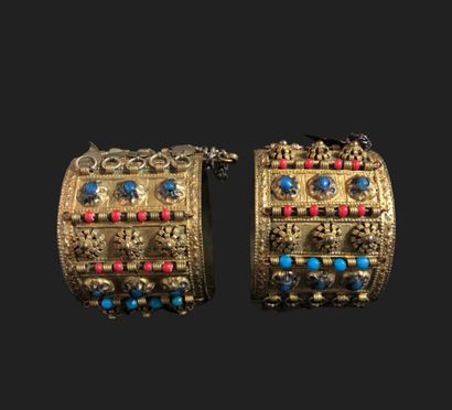 null PAIR OF GOLDEN METAL BRACELETS with compartmentalized decoration of stones and...