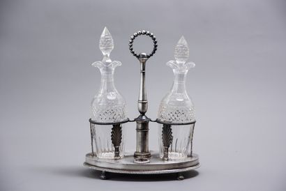 null SILVER] Empire style silver oil and wine cruet with palmettes decoration and...