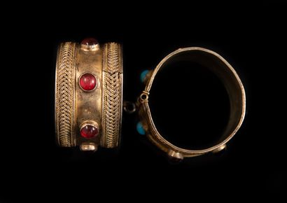 PAIR OF GOLDEN METAL BRACELETS inlaid with...