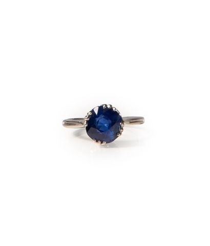 Platinum ring set with a round old-cut sapphire...