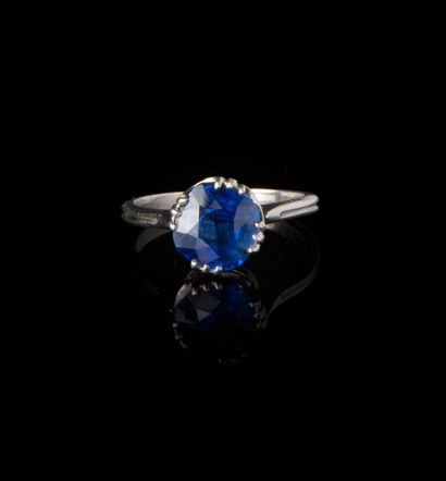 null Platinum ring set with a round old-cut sapphire weighing approximately 1.5 ct....