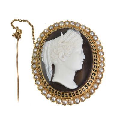 null CAMEE in brown agate carved with a profile of a woman in the antique style,...