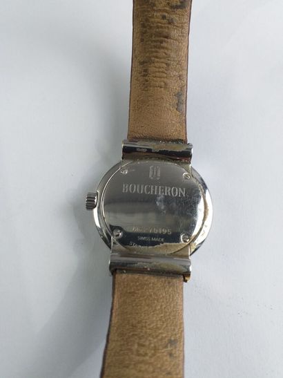 null BOUCHERON

REFLET.

Steel woman's wristwatch. Round case, bezel in 18K gold....