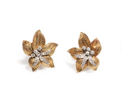 null BOUCHERON 

Pair of 18k yellow and white gold ear clips in the shape of a flower...