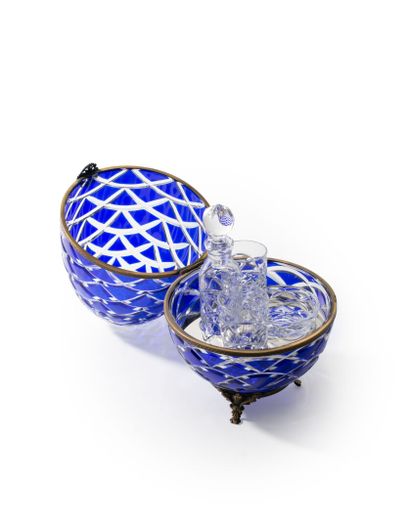 null FABERGE FRANCE, EGG in blue cut crystal of ovoid form and bronze mounting, the...
