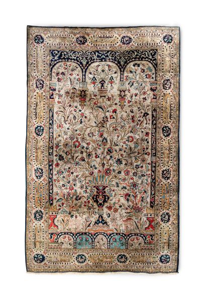 Knotted silk carpet decorated with a tree...