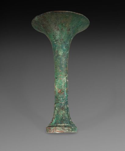 null Vase gu in bronze with green patina incised with banana leaves and taotie mask

China

H.:...