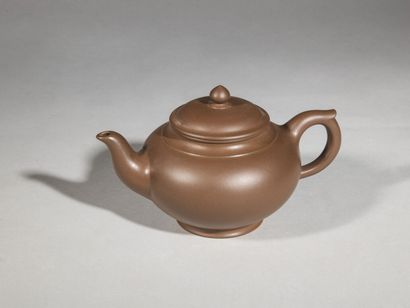 null Set of three yixing stoneware teapots

China, 20th century

one rectangular...