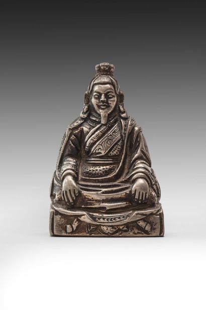 null Statuette of a seated lama in silver plated metal

Tibet, 19th century 

H.:...