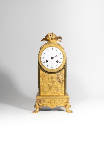 null Gilded bronze clock
Empire period
decorated with a bas relief of an allegory...