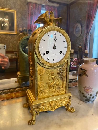 null Gilded bronze clock
Empire period
decorated with a bas relief of an allegory...