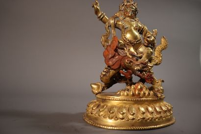 null TIBET, around 1900
Statuette of a white Jambhala in gilded bronze
seated on...