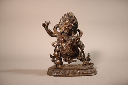null TIBET, 19th century
Fierce Vajrapani statuette in partially gold lacquered bronze
standing...