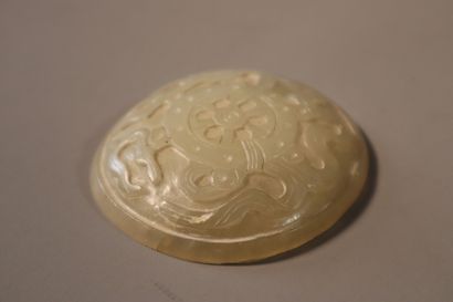 null CHINA, 19th century
Three celadon jade (nephrite) ruyi plates, 
- two carved...