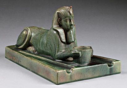 Emile MULLER "Sphinx" sculpure en faience de couleur verte, signée sur la terrasse,...