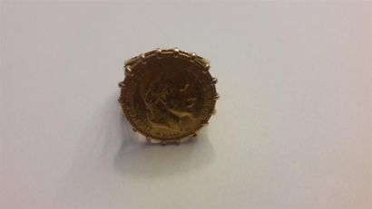 null Pièce de 10 francs or Napoléon III. 1965. Monté en bague en or. P: 8.3 gr. 