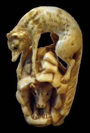 null Cachet en ivoire représentant un renard perché sur une grotte en pierre dans...