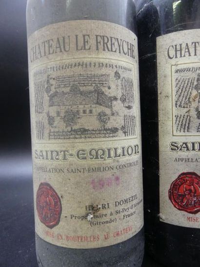 null 2 bouteilles de CHATEAU LE FREYCHE Saint émilion 1963 et 1985. Quelques taches...