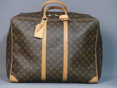 Louis VUITTON. Valise LOUIS VUITTON. Valise en cuir et toile monogrammée SP 0948....