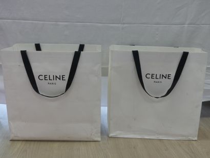 null CELINE. Réunion de deux sacs papiers. Déchirures et tâches