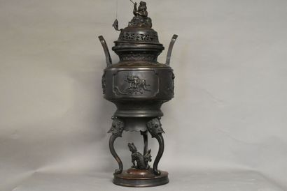 CHINE CHINA. A large bronze incense burner with brown patina, circular base and tripod...