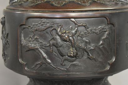CHINE CHINA. A large bronze incense burner with brown patina, circular base and tripod...