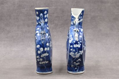 CHINE CHINA. Pair of porcelain gourd vases decorated with blue prunus. Marked under...
