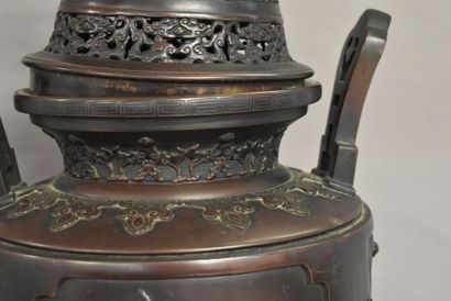 CHINE CHINA. A large bronze incense burner with brown patina, circular base and tripod...