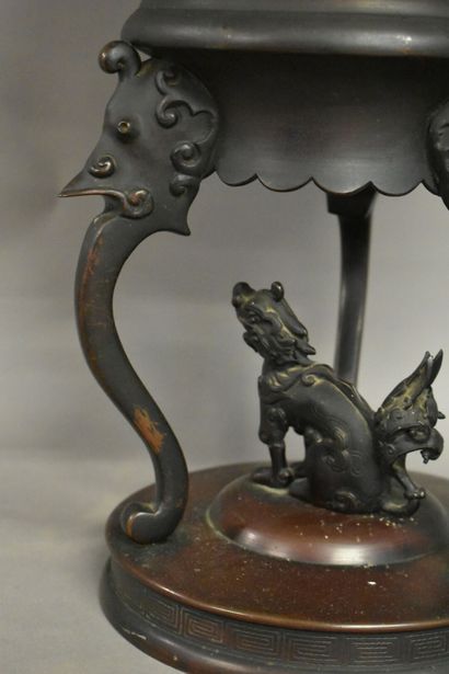 CHINE CHINA. A large bronze incense burner with brown patina, circular base and tripod...