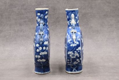 CHINE CHINA. Pair of porcelain gourd vases decorated with blue prunus. Marked under...