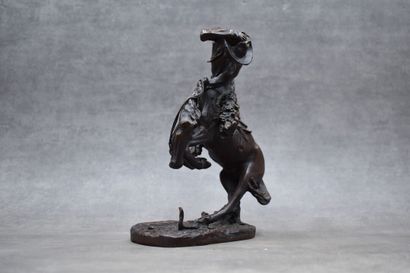 Frederic REMINGTON Frédéric REMINGTON (1861-1909) Cow Boy, bronze patiné. Signé sur...