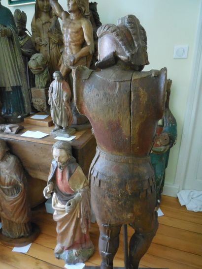 null Oak soldier carved in the round with remains of polychromy. Standing with his...