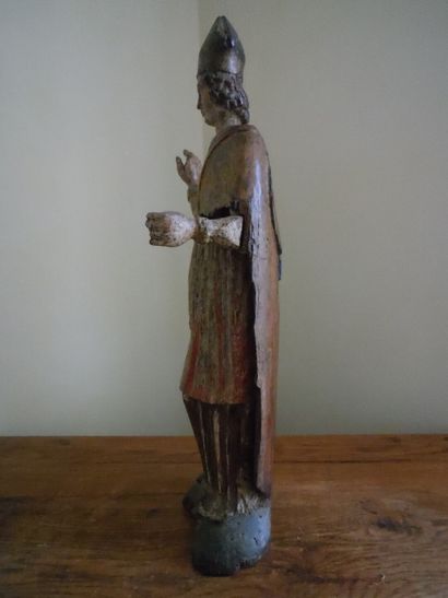 null Saint Bishop blessing in oak and poplar carved and polychromed. 17th century....