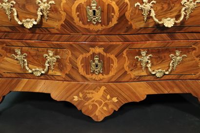 null Louis XV period. Attributed to COULERU. A plum and walnut veneered curved chest...