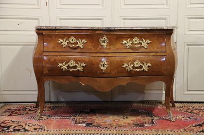 null Wooden chest of drawers inlaid with frames, curved on all sides. It opens with...