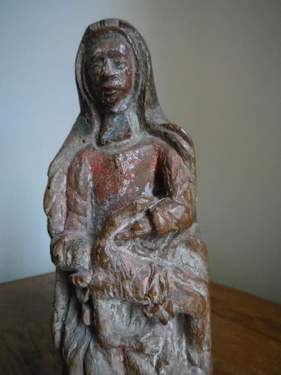 null Virgin of Pity in carved and polychromed wood, monoxyle base. 16th century....