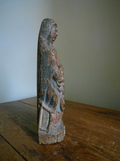 null Virgin of Pity in carved and polychromed wood, monoxyle base. 16th century....