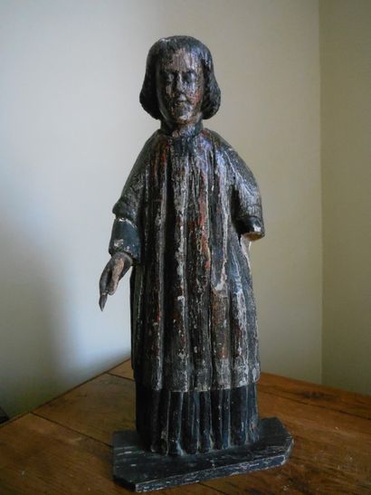 null Carved and polychromed wood ecclesiastic, hollowed back. End of the 17th century....
