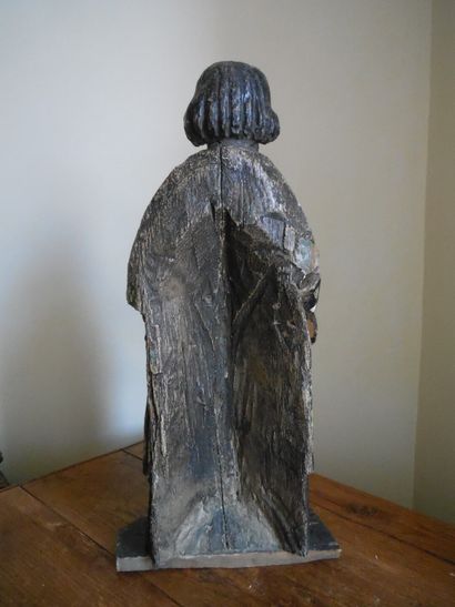 null Carved and polychromed wood ecclesiastic, hollowed back. End of the 17th century....