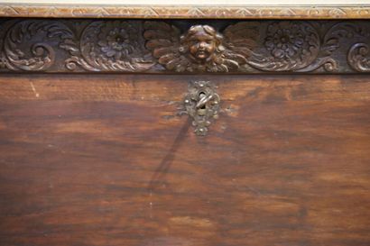 null Wooden chest carved with scrolls, angel's head and caryatid figures at the four...