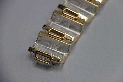 null LALIQUE - Marie-Claude LALIQUE. Large bracelet souple en métal doré orné de...