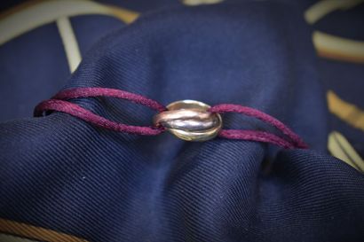 null CARTIER. Trinity. Bracelet composé de trois anneaux en or jaune, rose et blanc...